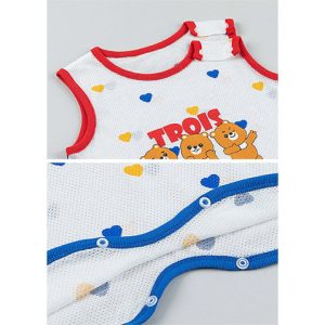 Child wearing Trois Summer Mesh Sleeping Vest with colorful hearts pattern and 'Trois Amis' design, showcasing a comfortable and playful option for toddler summer nightwear