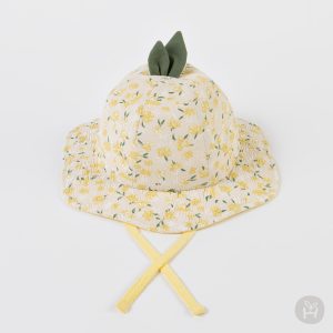 Jini Baby Girl Sun Hat featured in a serene setting, highlighting its floral design and lightweight structure, ideal for baby’s summer outings. Available now at Tiny You Baby Store