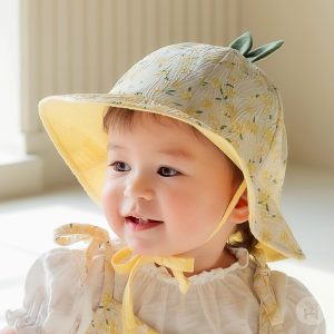 Jini Baby Girl Sun Hat featured in a serene setting, highlighting its floral design and lightweight structure, ideal for baby’s summer outings. Available now at Tiny You Baby Store