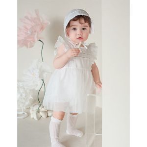 Photograph showing a baby girl dressed in the Lainie Baby Girl Bodysuit, focusing on the delicate lace details and soft fabric, perfect for special occasions