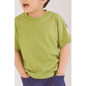 Child wearing Apple Jam green cotton T-shirt with a playful apple badge on the sleeve, perfect for casual wear.