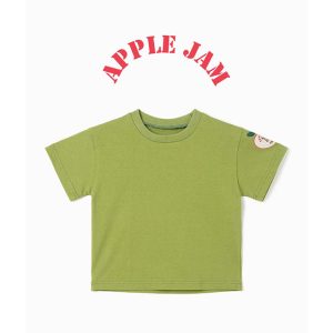 Child wearing Apple Jam green cotton T-shirt with a playful apple badge on the sleeve, perfect for casual wear.